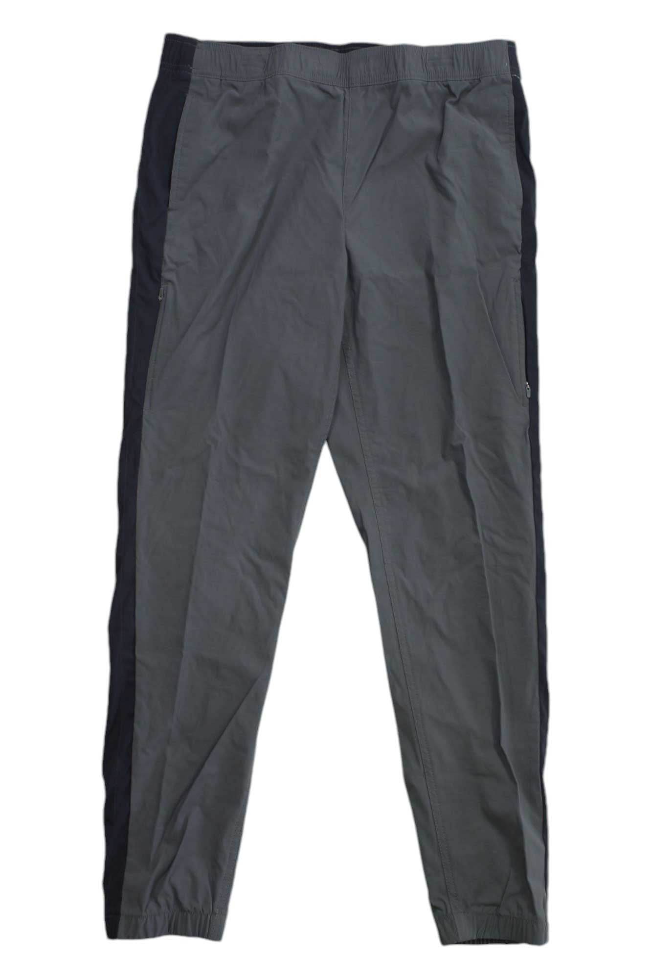 The Eddie Bauer First Ascent Women's Guide Jogger features gray fabric, black side panels, an elastic waistband, and elastic ankle cuffs, shown against a white background.