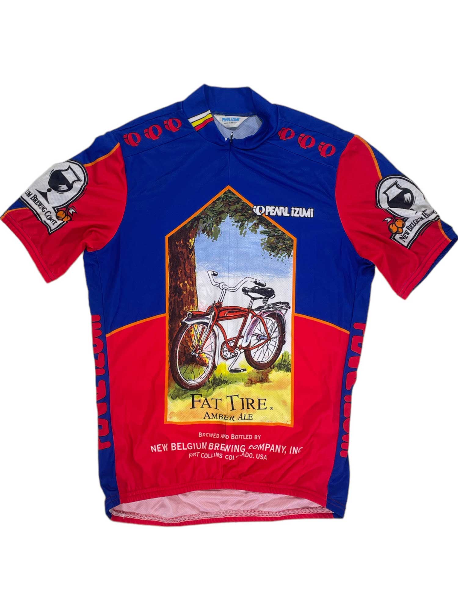The Fat Tire Jersey by Pearl Izumi features red and blue colors, a red bicycle under a tree illustration, and sleeve logos—an ideal cycling jersey for Fat Tire Amber Ale fans.