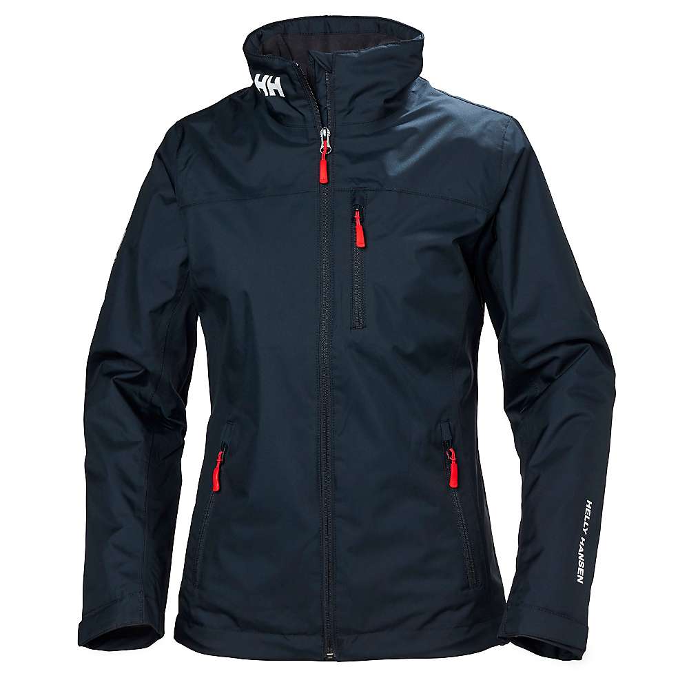Navy blue Helly Hansen Womens Crew Midlayer Jacket with red zipper pulls, a high collar featuring a logo on the back, and a logo on the left sleeve.