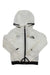 The North Face Girls Windwall Hoodie is a lightweight, translucent white jacket with black trim, front zipper, long sleeves, recycled nylon ripstop fabric, and the logo on the left chest. Wind-resistant for added protection.