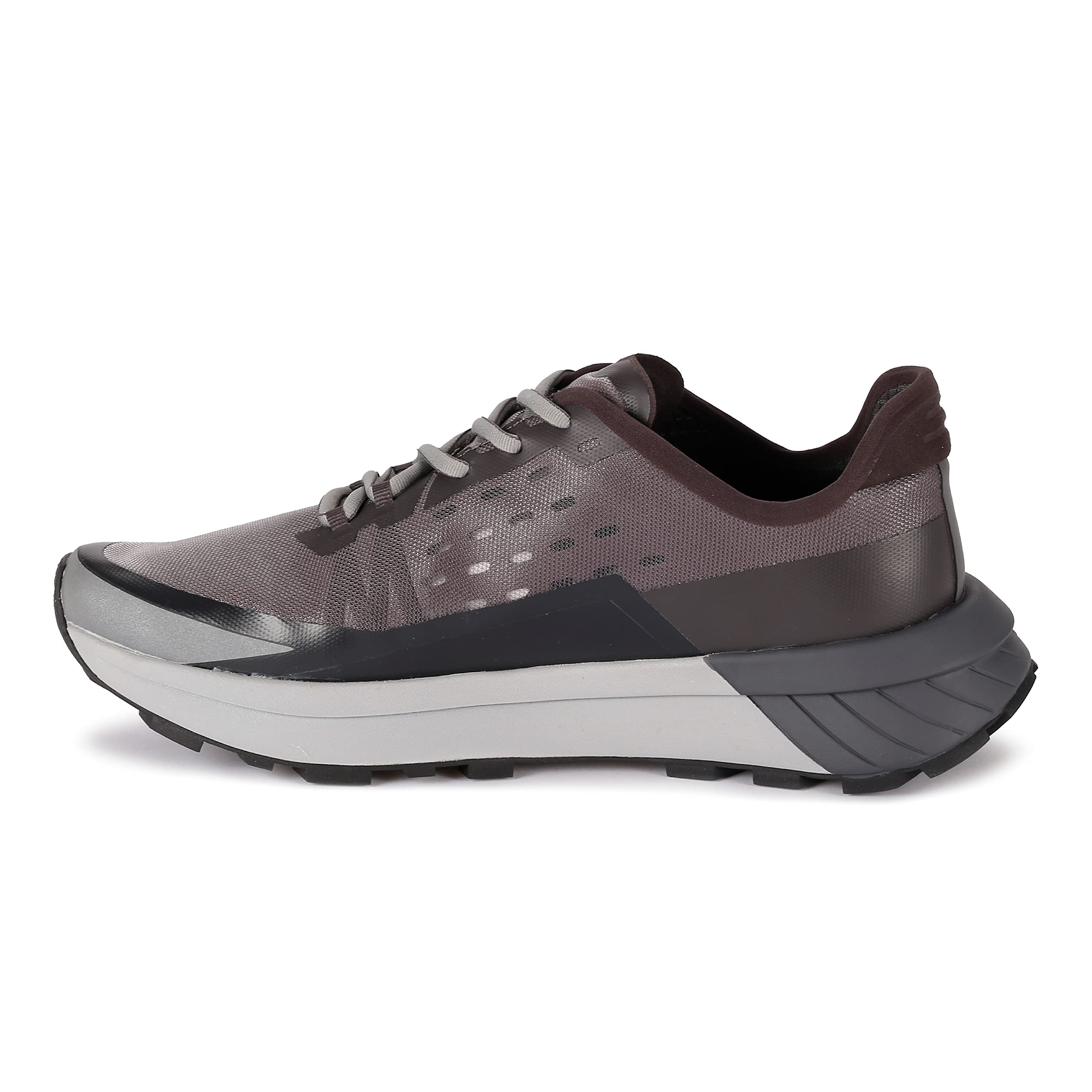 A side view of the Spyder Men's Trail Running Shoes in Mid Grey, featuring black and light grey accents, a thick textured sole, and a mesh-like upper designed for trail running.