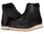 A pair of Kodiak Devick Wedge Moc Toe Shoes Black featuring brown and white soles, cushioned insoles, light stitching, metal eyelets, and suede ankle accents—one boot upright, the other slightly angled behind.