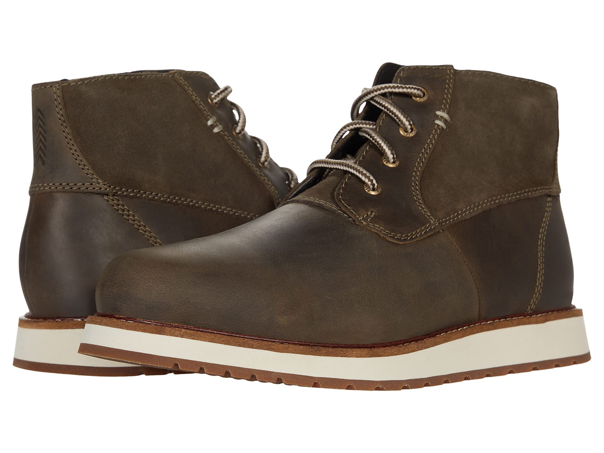 A pair of Kodiak Maltby Wedge Chukka Brown Shoes with white rubber soles, tan midsoles, contrast stitching, and round laces—one shoe faces forward, the other is angled.