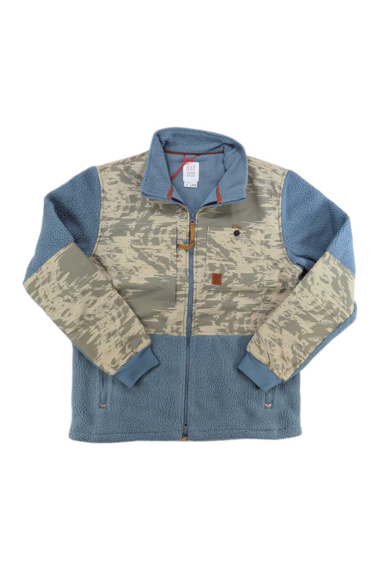 The Topo Designs Men's Subalpine Fleece Printed Jacket features a zip-up design, blue Polartec fleece sleeves and lower body, beige and gray camo chest and back, a brown patch, high collar, and front pockets—ideal for outdoor adventures.