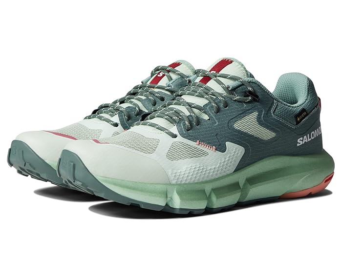 A pair of Salomon Predict Hike GTX Hiking Shoes in light green and teal, with mesh uppers, textured soles, red accents, and GORE-TEX technology, are positioned side by side at a slight angle.