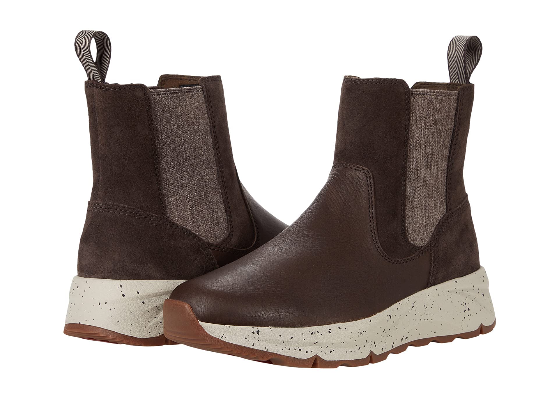 The Kodiak Takla Dark Brown Chelsea Boot - 7.5 M features stretch side panels, pull tabs, a mix of suede and leather textures, and thick white speckled rubber soles with grooved brown outsoles for easy slip-on style.
