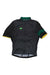 The Rapha Mens Super Lightweight Jersey is a black, short-sleeve cycling jersey with a green collar, yellow sleeve trim, a small Brazilian flag patch on the chest, subtle patterned sleeves, and a front zipper.