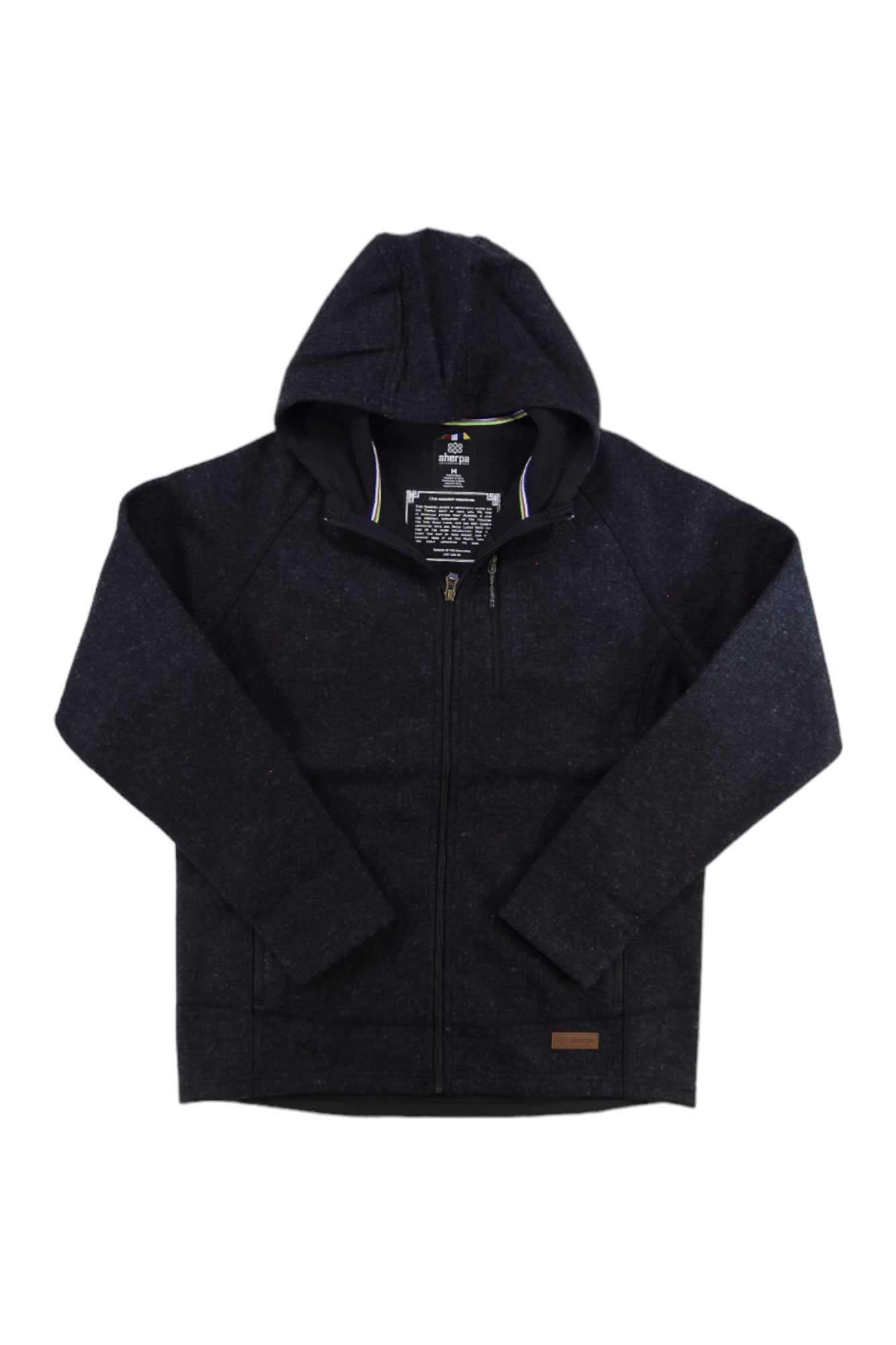 The Sherpa Mens Namgyal Hoodie by Sherpa is a wind-resistant black wool zip-up with long sleeves, raglan shoulders, and a small brown patch near the hem, shown on a white background—ideal as a men’s travel jacket.