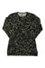 The Burton Womens Midweight Base Layer Crew is a long-sleeve shirt with a black base and green/beige abstract pattern, featuring DRYRIDE Ultrawick tech. Displayed flat on a white background.