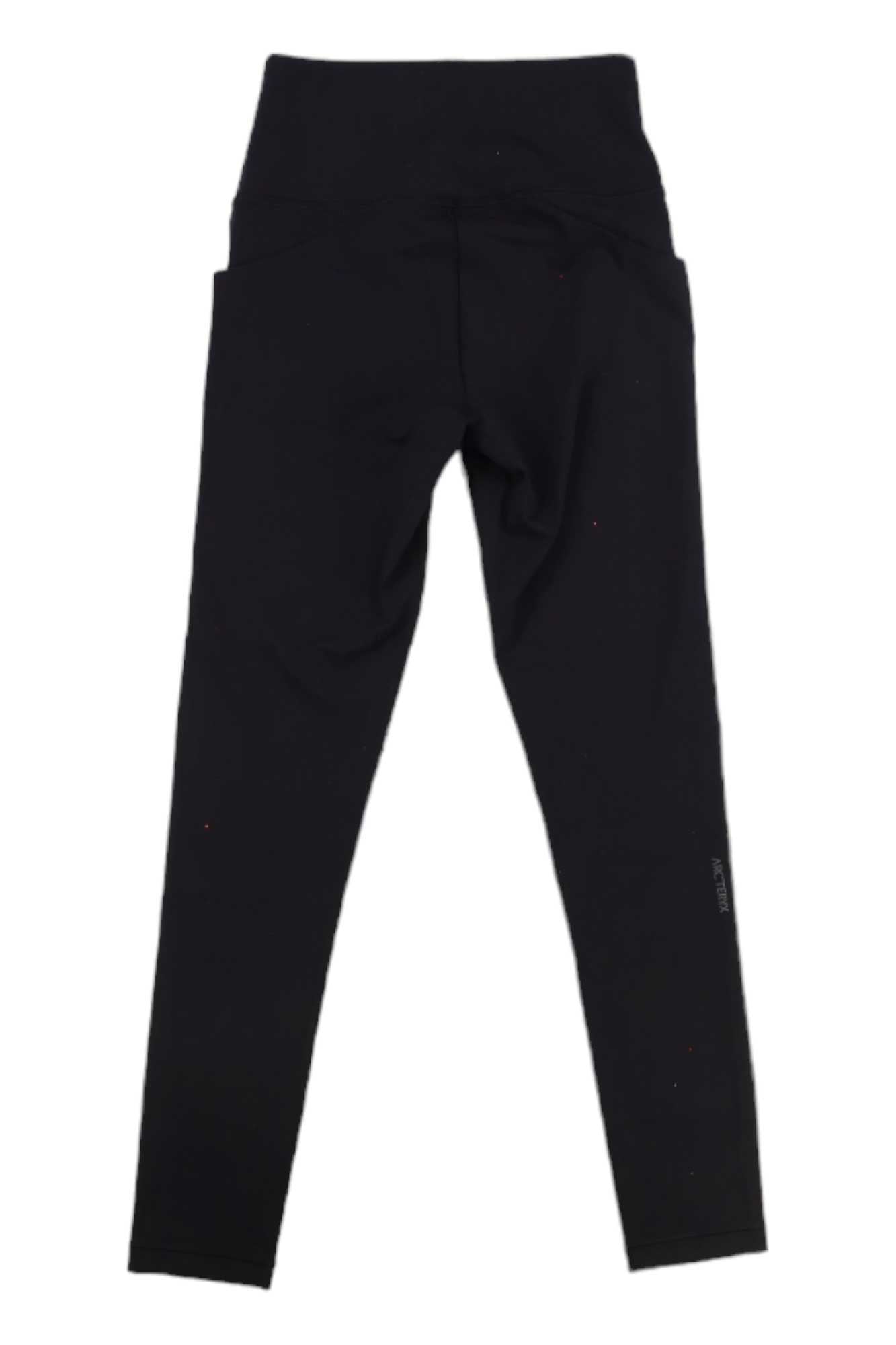 The Arcteryx Womens Essent High-Rise 26 Inch Legging in black, shown laid flat with the back side facing up.