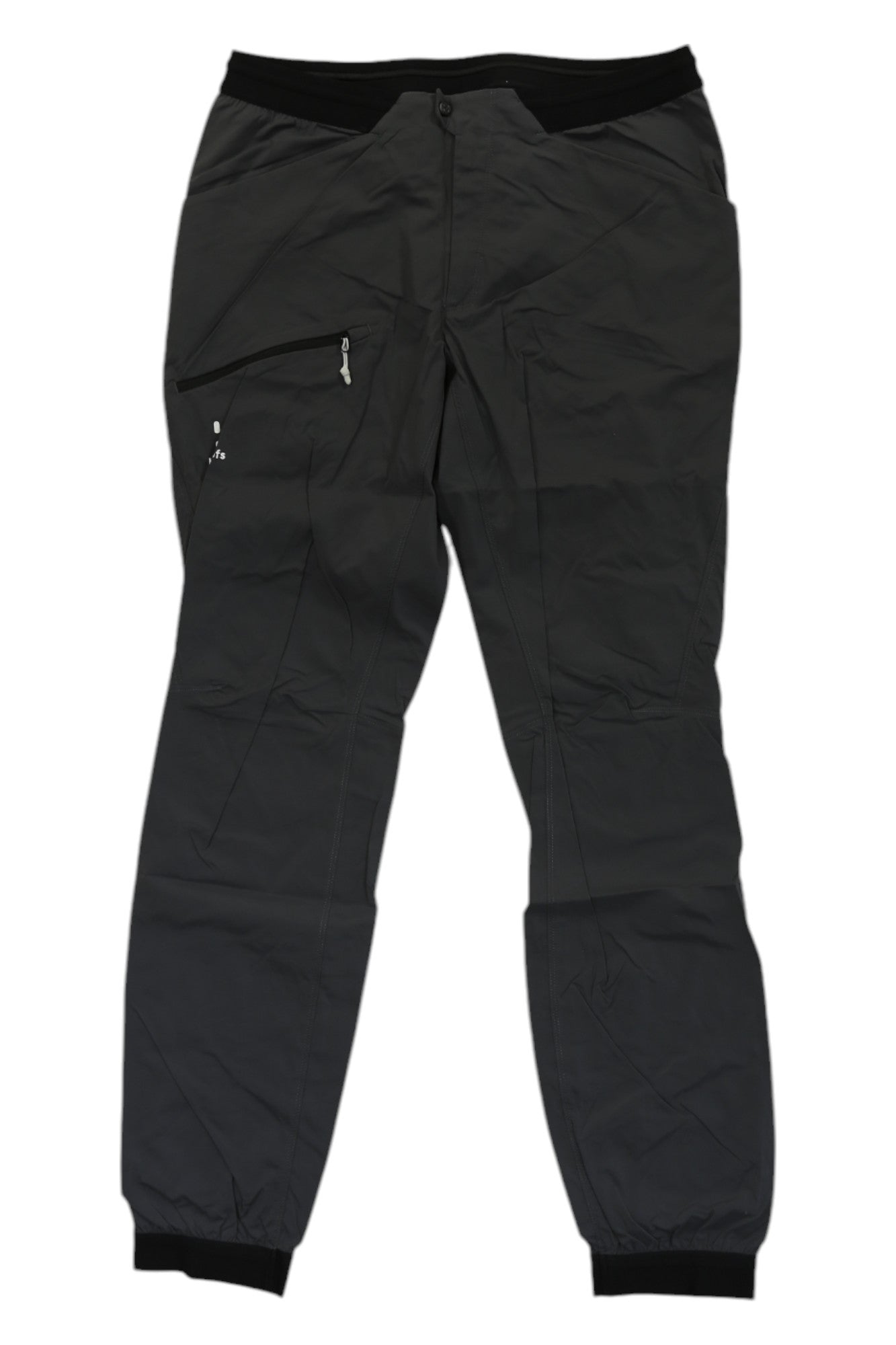 The Haglofs Womens L.I.M Fuse Pant, shown laid flat on a white background, is a pair of breathable dark gray outdoor pants with an elastic waistband, ankle cuffs, and a right-side zippered pocket.