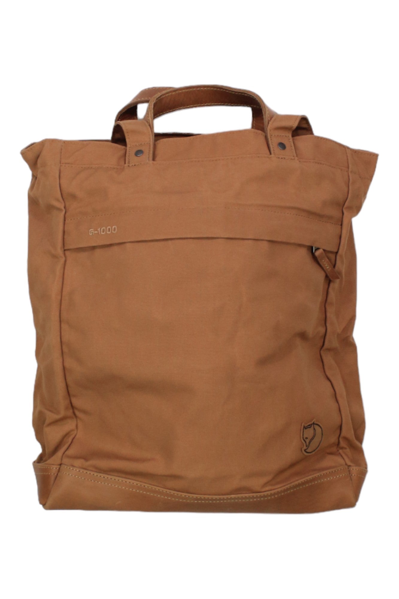 The Fjallraven Totepack No. 2 in brown canvas features short handles, a front pocket, and a small fox head logo at the bottom right—ideal as a versatile daypack for any outing.