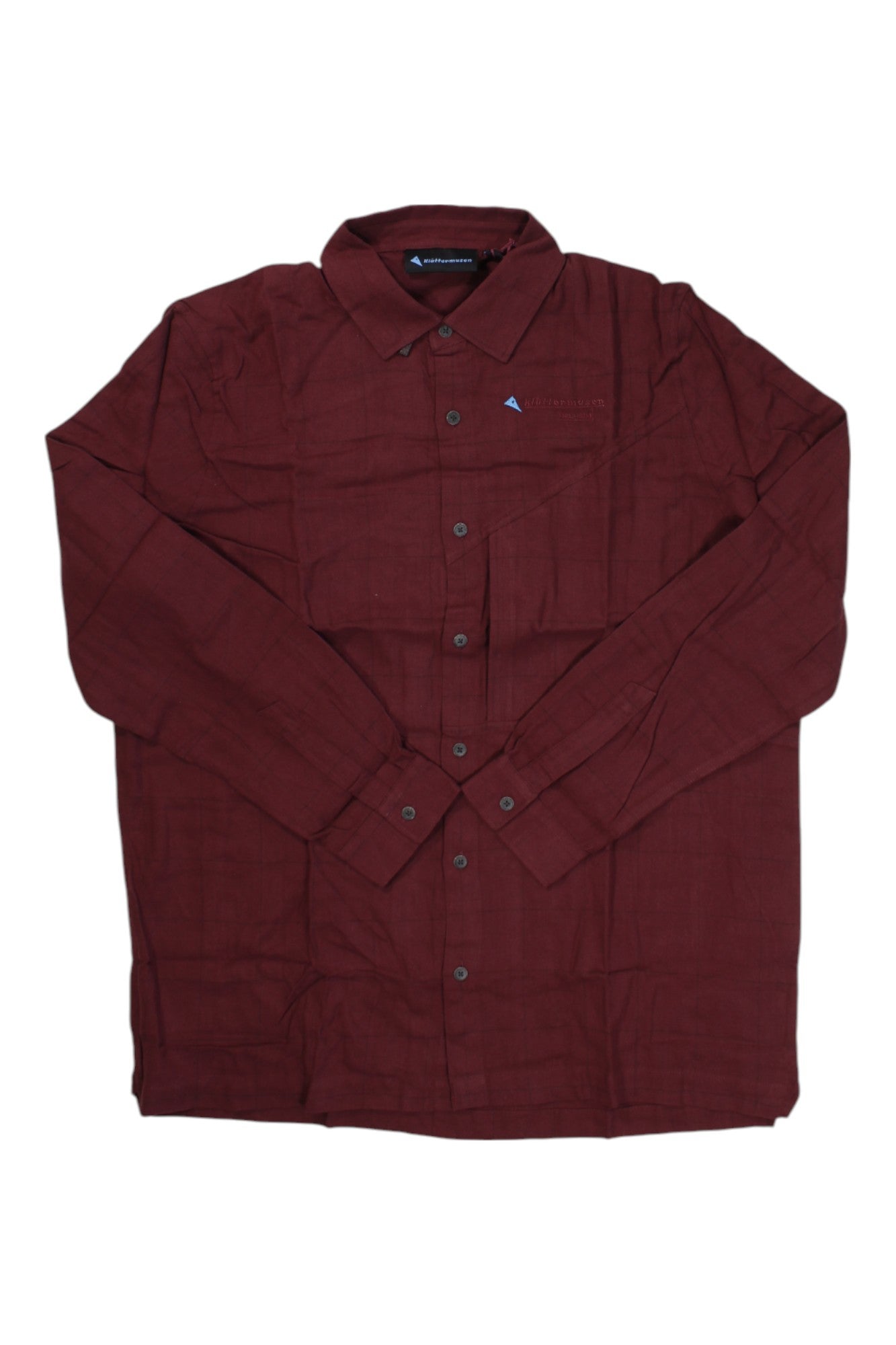 The Klattermusen Mens Helheim LS Shirt is a maroon, long-sleeved, button-up outdoor shirt with a collar, shown flat on a white background. It features moisture-wicking fabric for comfort and style.