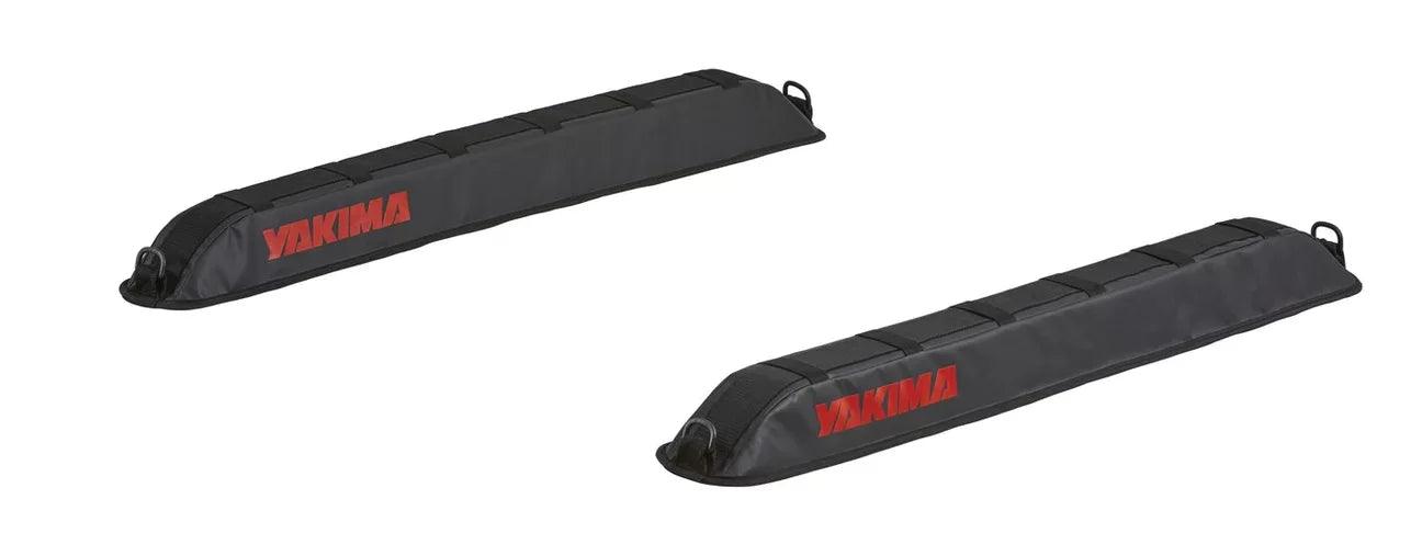 Two black Yakima EasyTop Soft Rack pads with red lettering, shown on a white background. These elongated pads feature straps for secure attachment to vehicle roof racks.