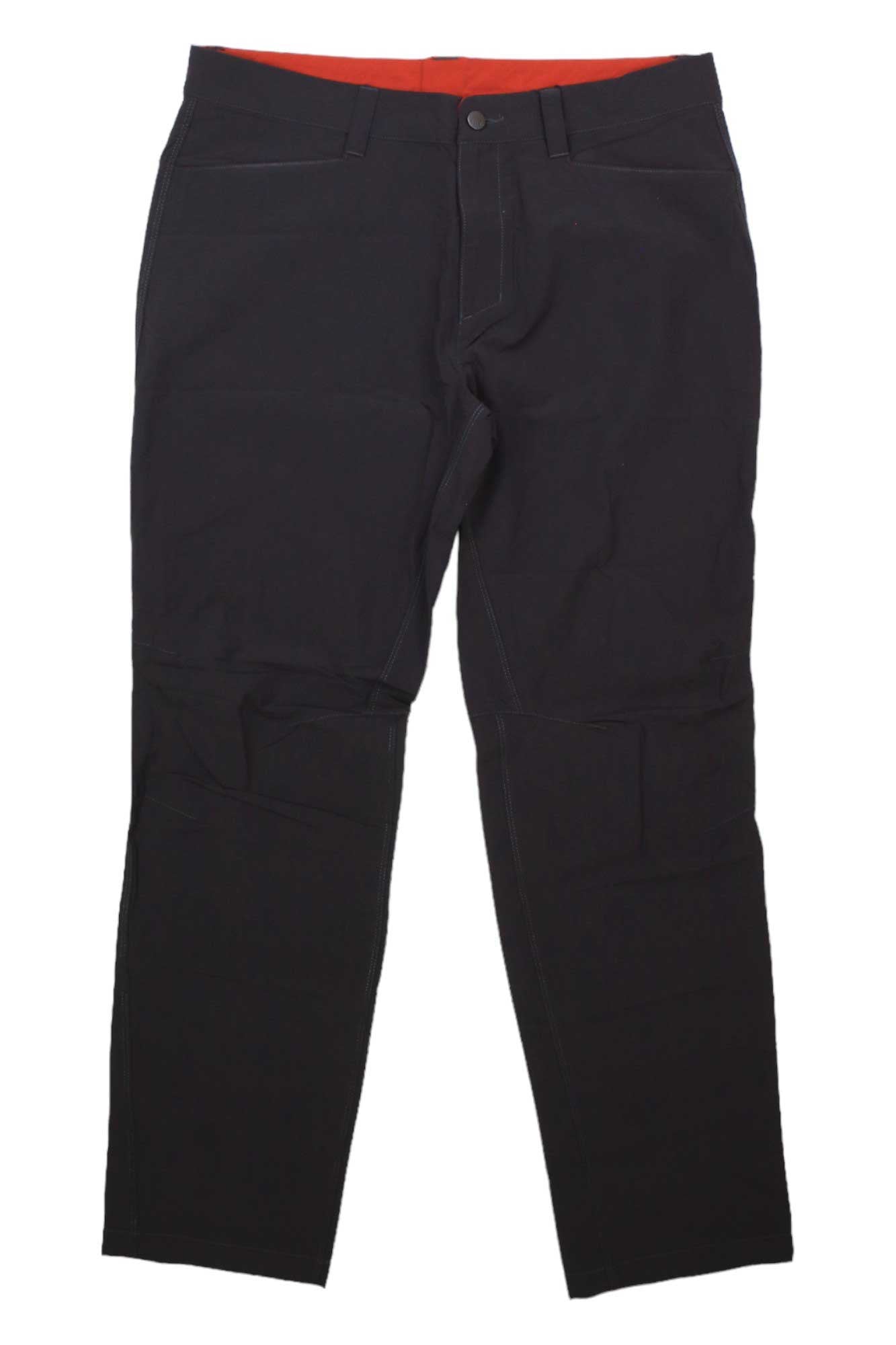Rab Men's Capstone Pant in black features straight leg cut, visible stitching, front pockets, stretch nylon fabric, and a red inner waistband—perfect hiking pants or for everyday wear.