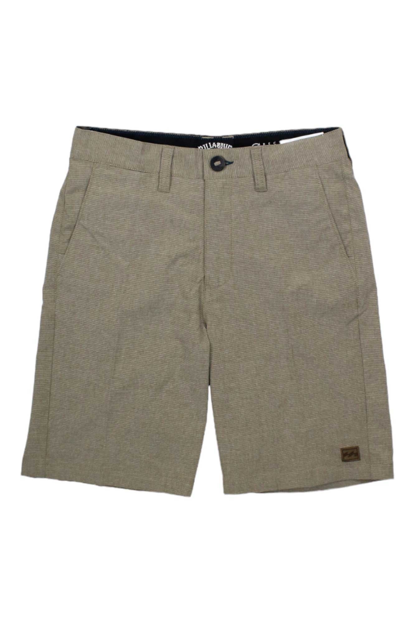 The Billabong Boys Crossfire Short is a light brown, eco-friendly short with button and zipper closure, belt loops, quick-dry comfort, front and back pockets, and a small rectangular logo patch on the lower left leg.