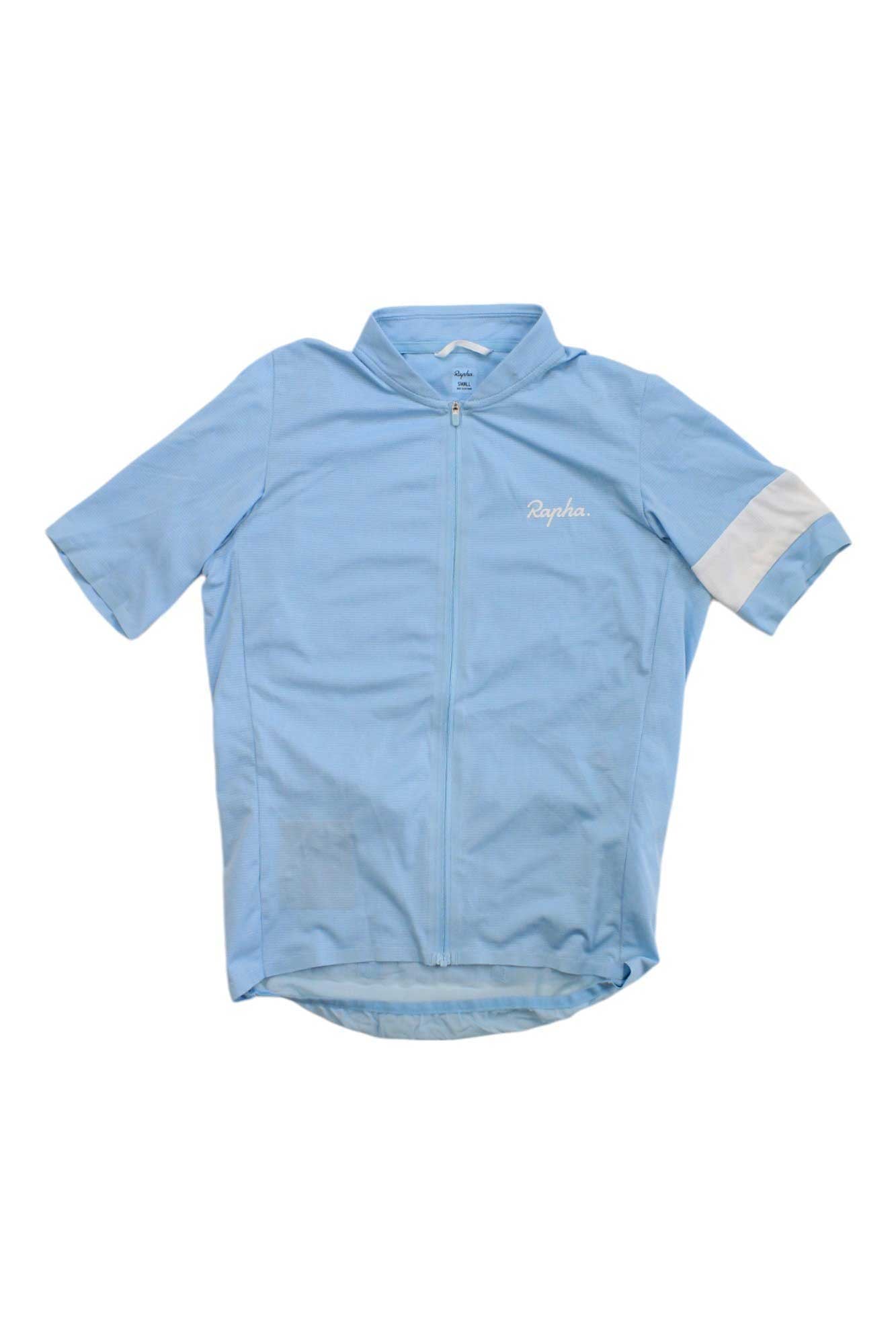 The Rapha Mens Classic Flyweight Jersey in light blue features a front zipper, white left sleeve stripe, and chest Rapha logo. This lightweight jersey is shown laid flat on a white background and is crafted for peak cycling performance.