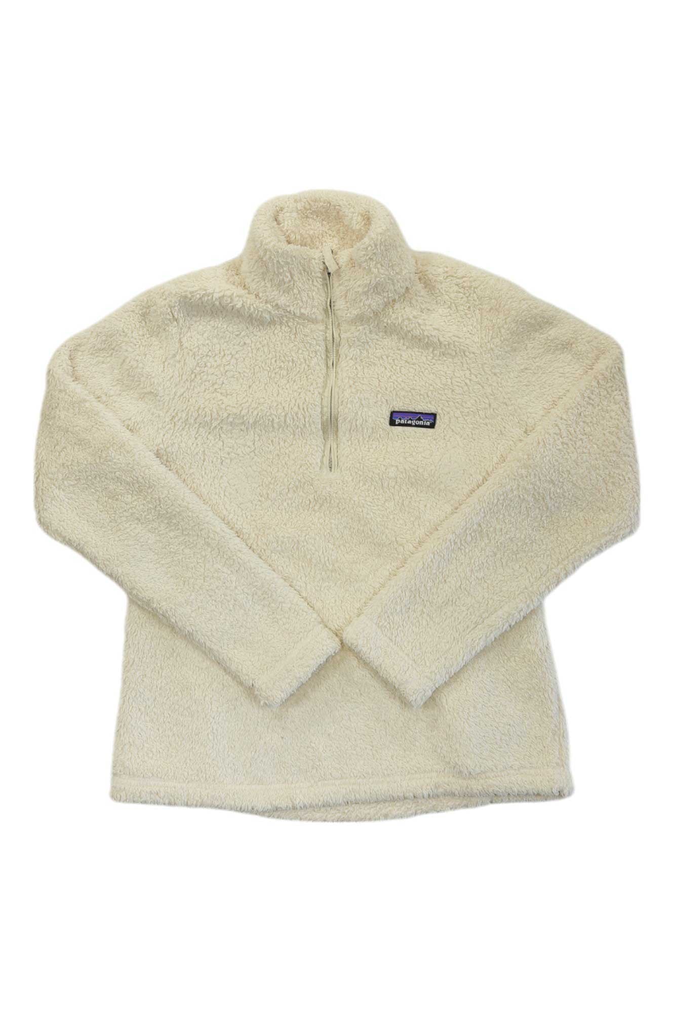 The Womens Los Gatos 1/4-Zip Fleece is a cream, long-sleeve pullover made from soft recycled polyester fleece with a stand-up collar, left chest rectangular logo patch, and Fair Trade Certification.