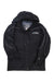 The Womens Spyder Ski Jacket in black features a hood, front zipper, snap buttons, white sleeve piping, and a Spyder logo patch on the chest for stylish warmth.