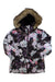 The Roxy Womens Jet Ski Jacket features a pastel floral and butterfly design, a brown faux fur-trimmed hood, and insulation to keep you warm and stylish on the slopes.