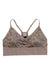 The Kari Traa Womens Var Printed Sports Bra in tan features a subtle floral pattern, thin adjustable straps, and a wide branded band at the bottom for light support.