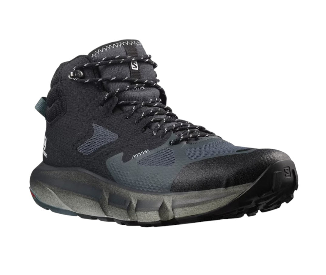 The Salomon Mens Predict Hike GTX Shoe is a waterproof black and dark gray hiking shoe with a rugged sole, mesh panels, patterned laces, high ankle design, GORE-TEX technology, and Salomon branding on the tongue and side.