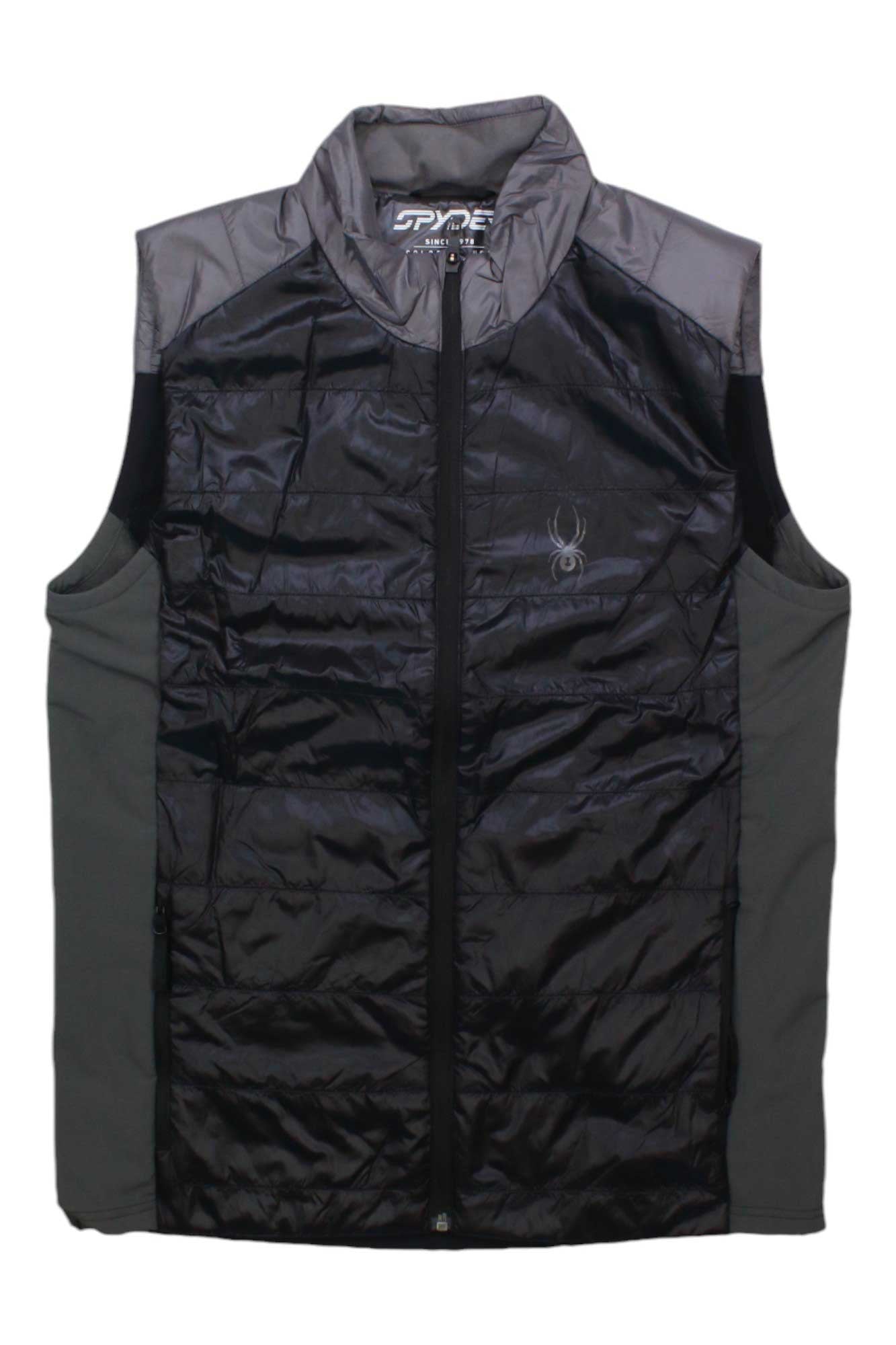 The Spyder Mens Glissade Vest is a sleeveless black and gray waterproof vest with Primaloft insulation, a front zipper, high collar, and subtle chest logo—ideal for snowsports enthusiasts.