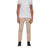 A person is wearing a white short-sleeve t-shirt, Mammut Men's Massone Light Pant in eco-friendly beige with a black logo patch on the left leg, and black shoes, standing against a plain white background.