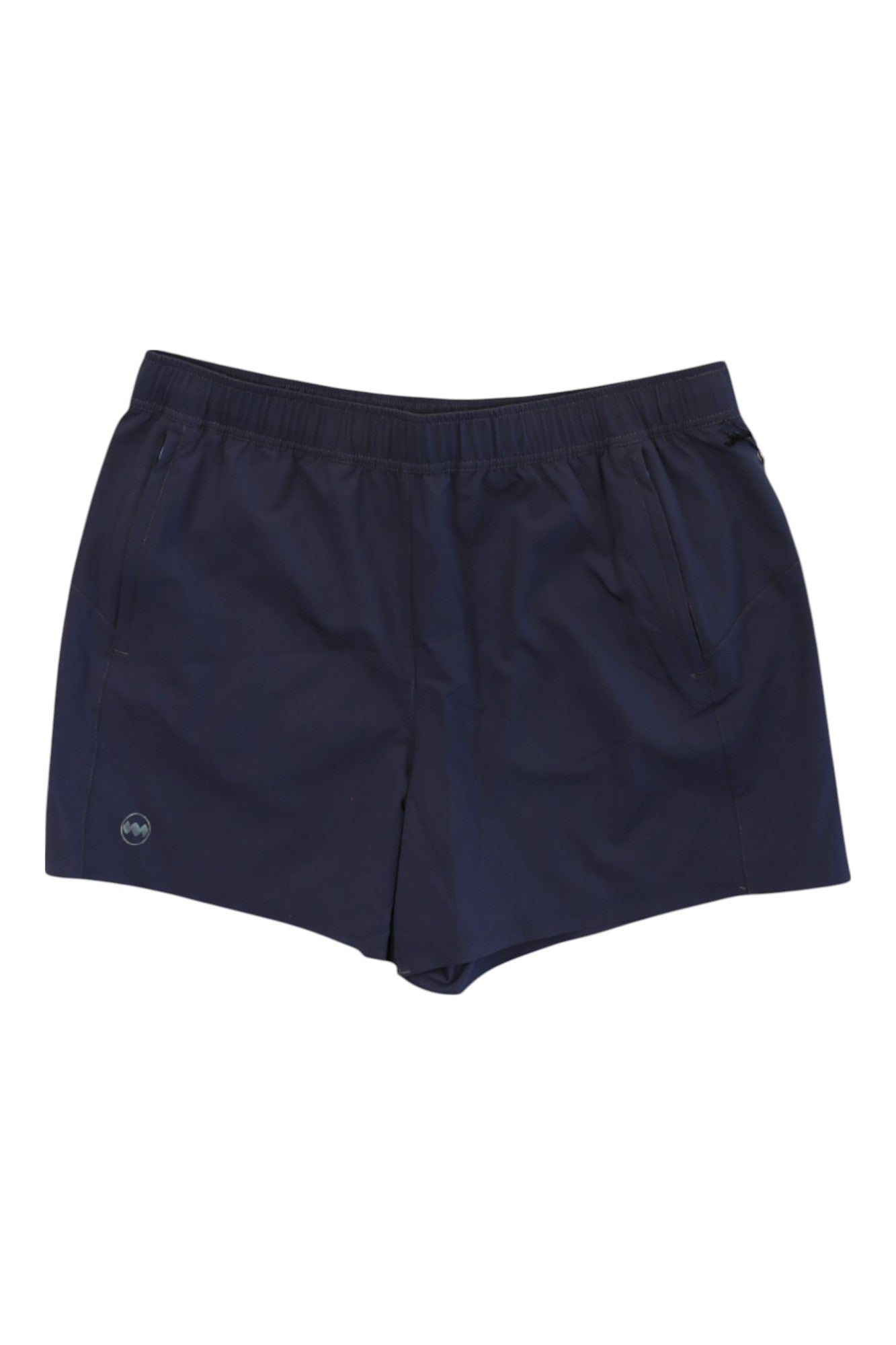 The Janji Womens 3 in Transit Tech Short features navy blue lightweight fabric, an elastic waistband, side pockets, and a small circular logo on the left leg. The women’s shorts are shown laid flat on a white background.