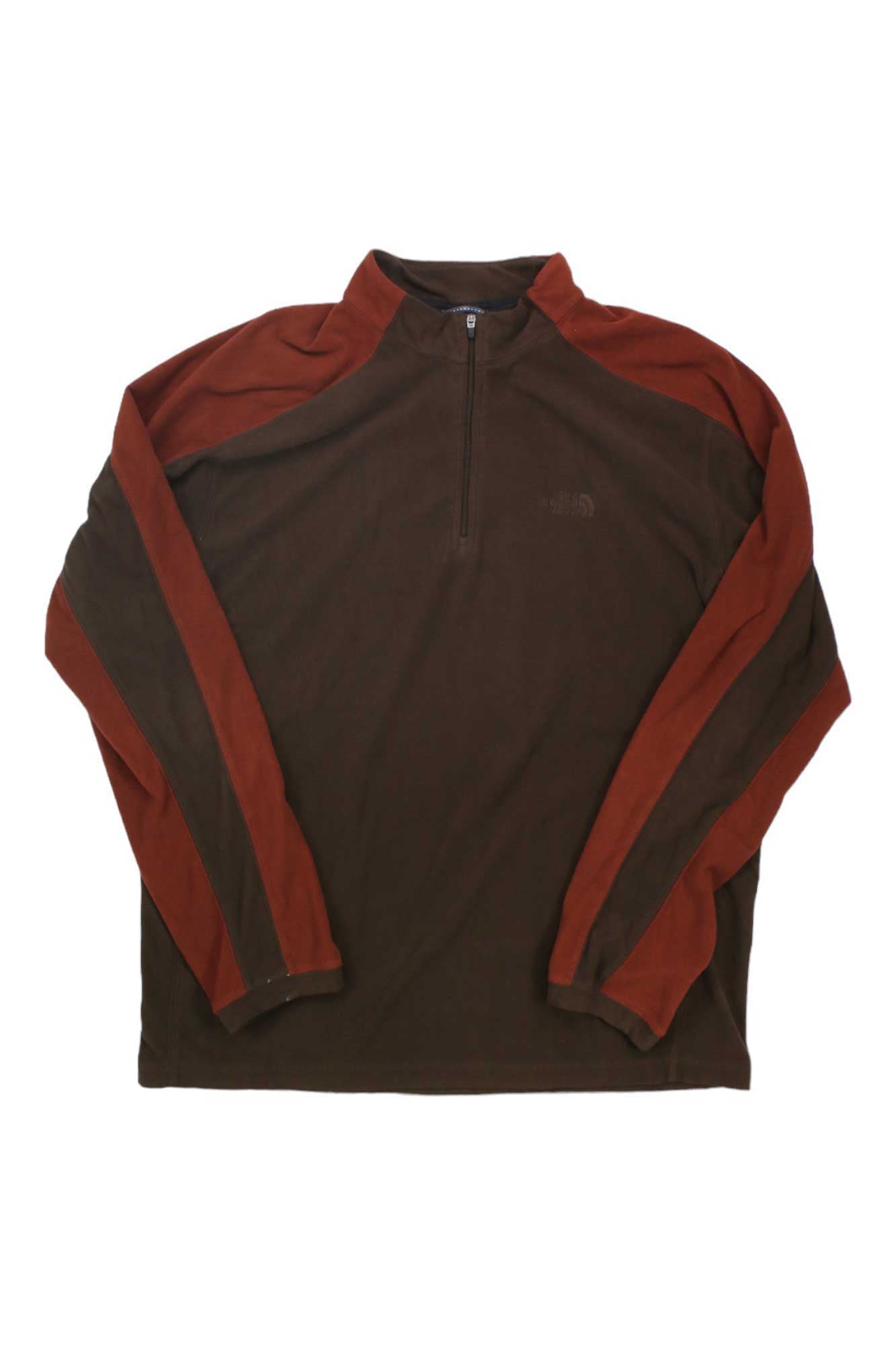 The North Face Mens TKA 100 Micro 1/4 Zip Pullover is a breathable, long-sleeve fleece with a brown body and reddish-brown sleeves and shoulders—ideal for hiking layering, shown laid flat on a white background.