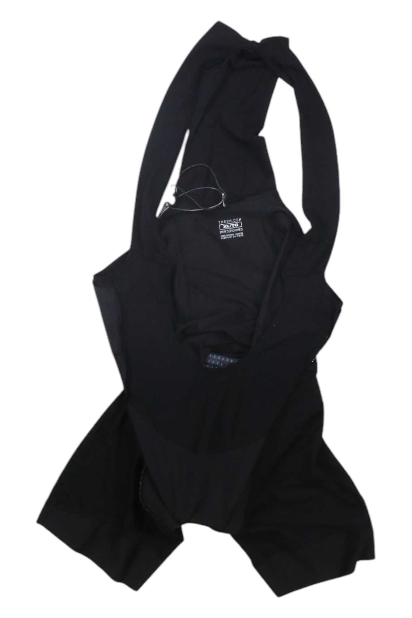 The 7mesh Men's Foundation Bib Short, inspired by the breathable comfort of cycling wear, is laid flat on a white background and comes with a clear plastic hanger and visible tag.