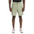 A person wears The North Face Men's Sprag Short in light green, paired with a black shirt and white athletic shoes, standing against a white background. The shorts have side pockets, a button closure, and are made from recycled nylon.