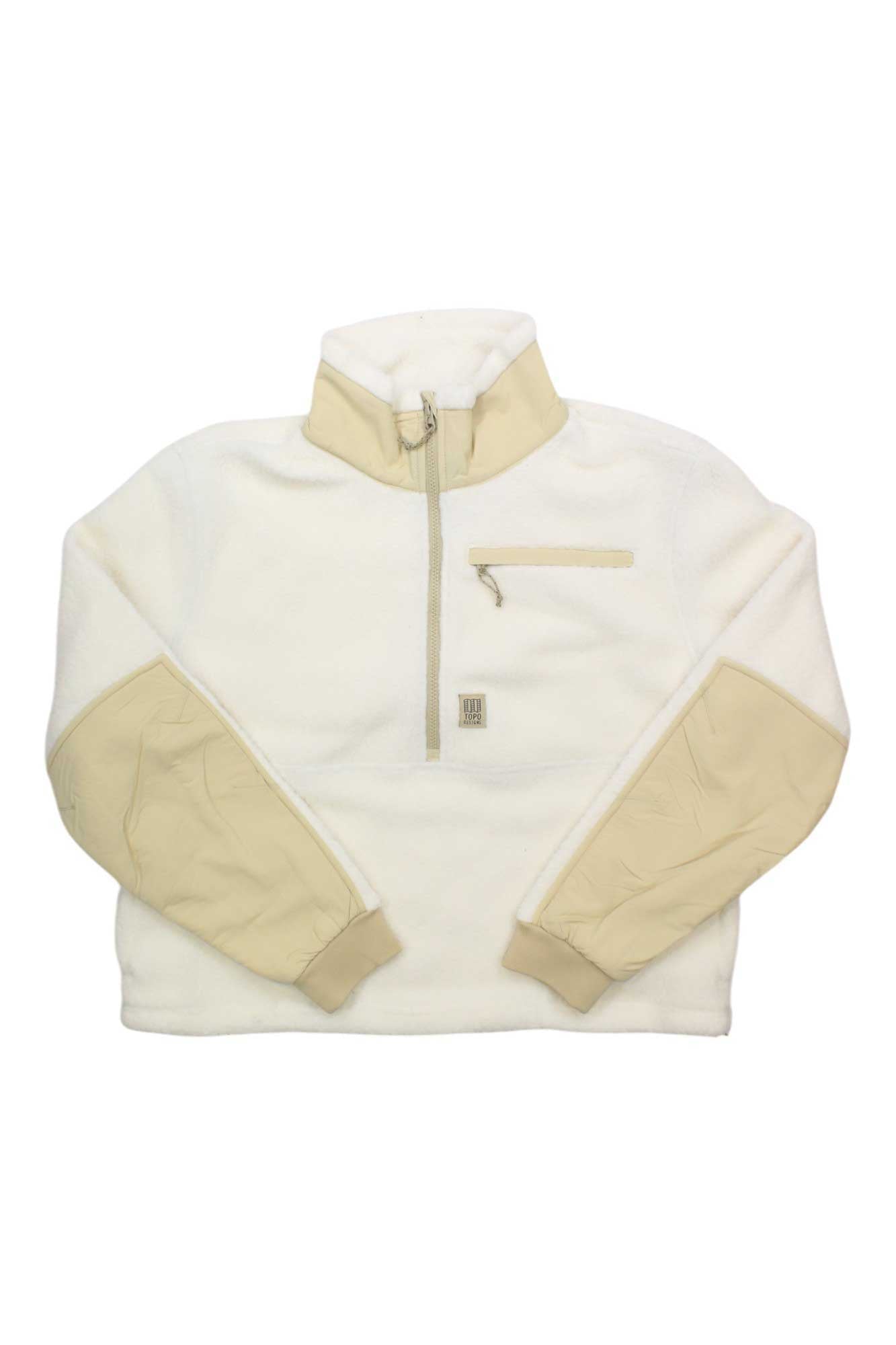 The Topo Designs Women's Mountain Fleece Pullover is made from recycled polyester and features a light beige zip-up collar, beige chest pocket with zipper, quilted elbow patches, plus cozy beige cuffs and hem.