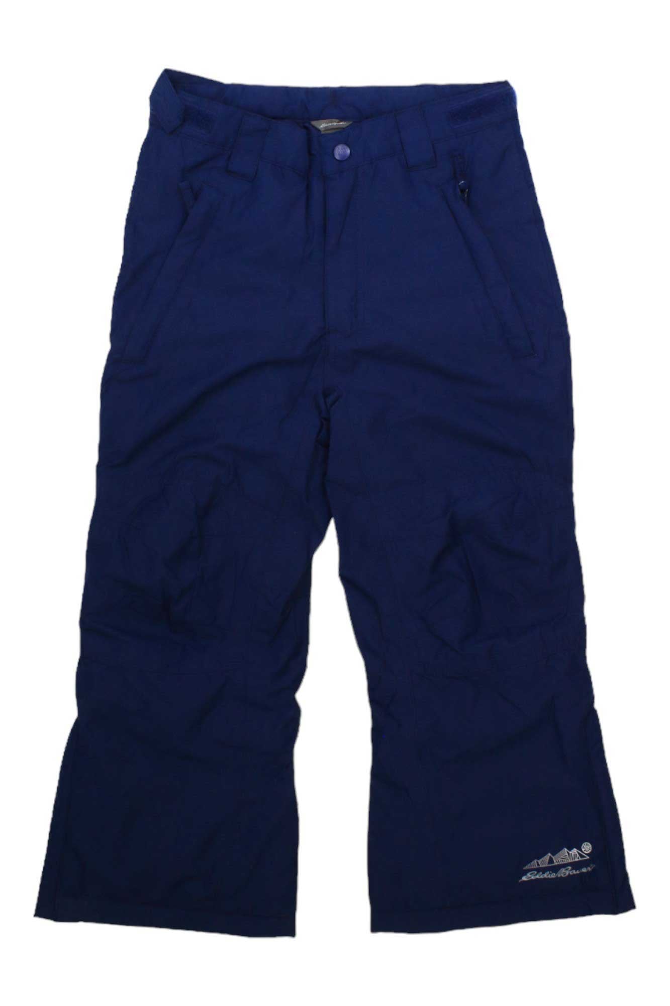 An Eddie Bauer Kids Powder Search Pant in dark blue, featuring front pockets, belt loops, and a button closure, is shown laid flat on a white background.