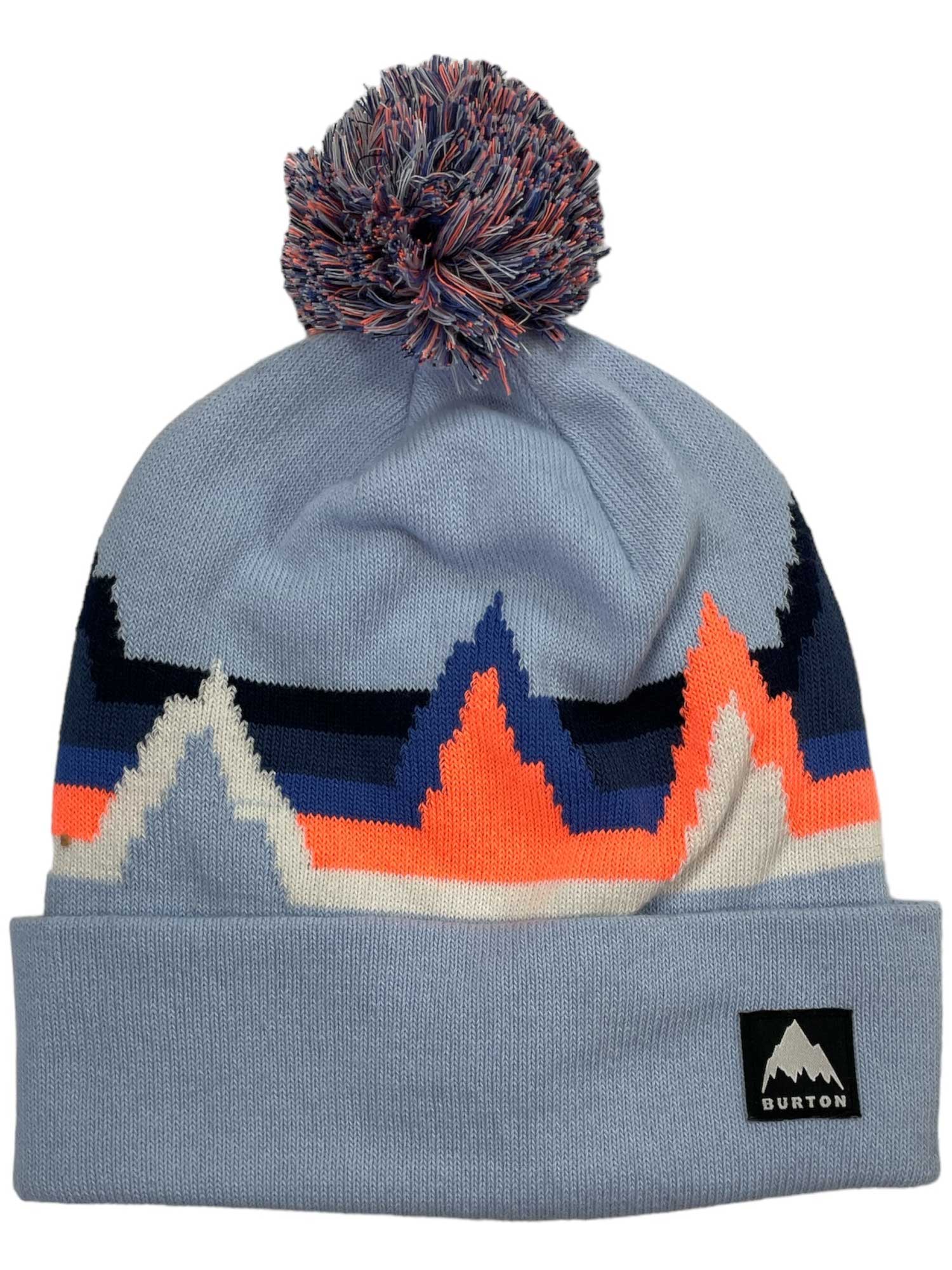 The Burton Kids Recycled Echo Lake Beanie is light blue with a multicolored zigzag mountain pattern in blue, orange, white, and navy. It features a pom-pom and a black and white Burton logo patch on the front.