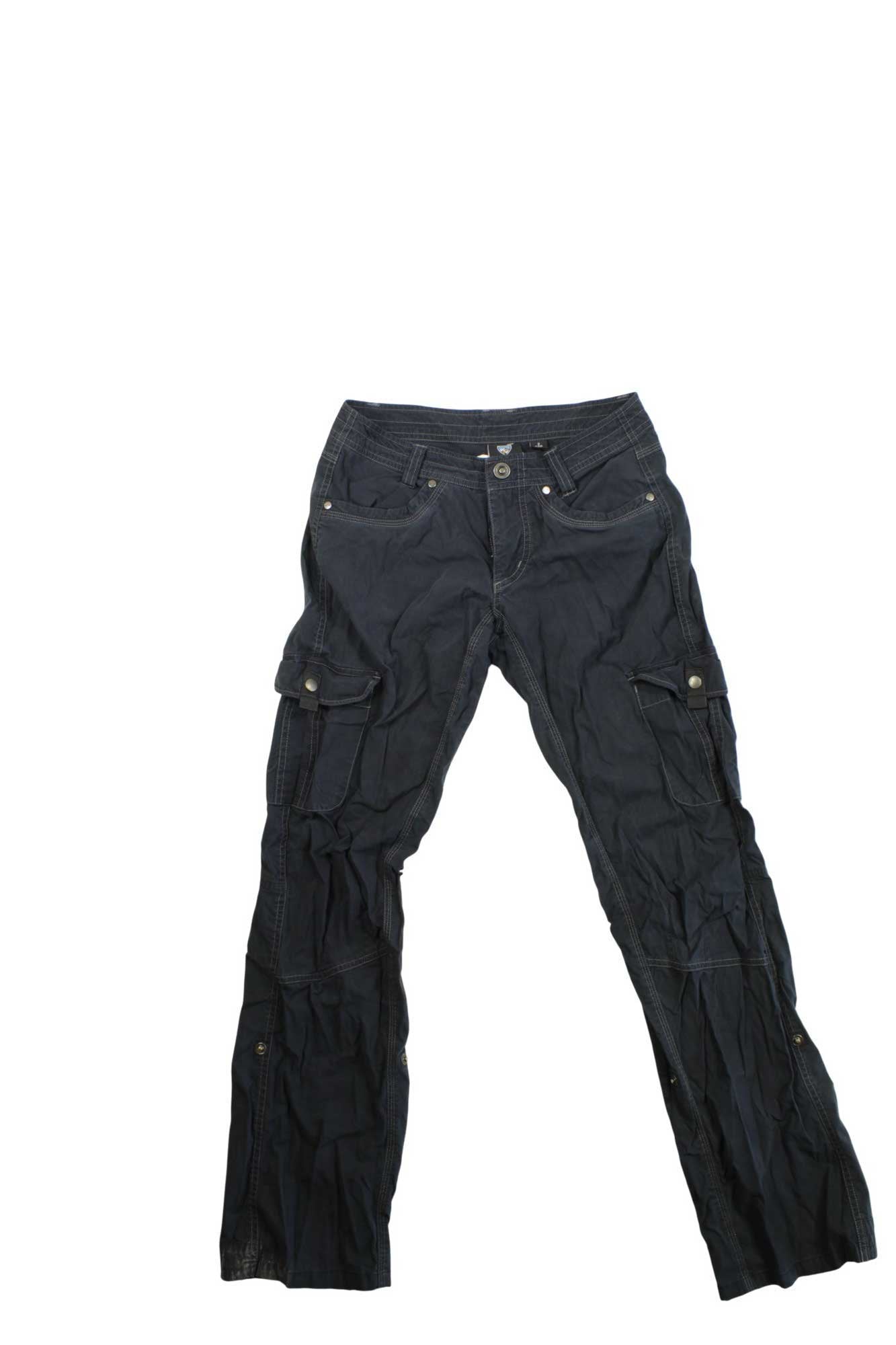 The Kuhl Womens Legendary Hiking Pants are dark grey adventure pants with multiple pockets, a button and zipper closure, and sewn details—ideal for women who need durable hiking wear.