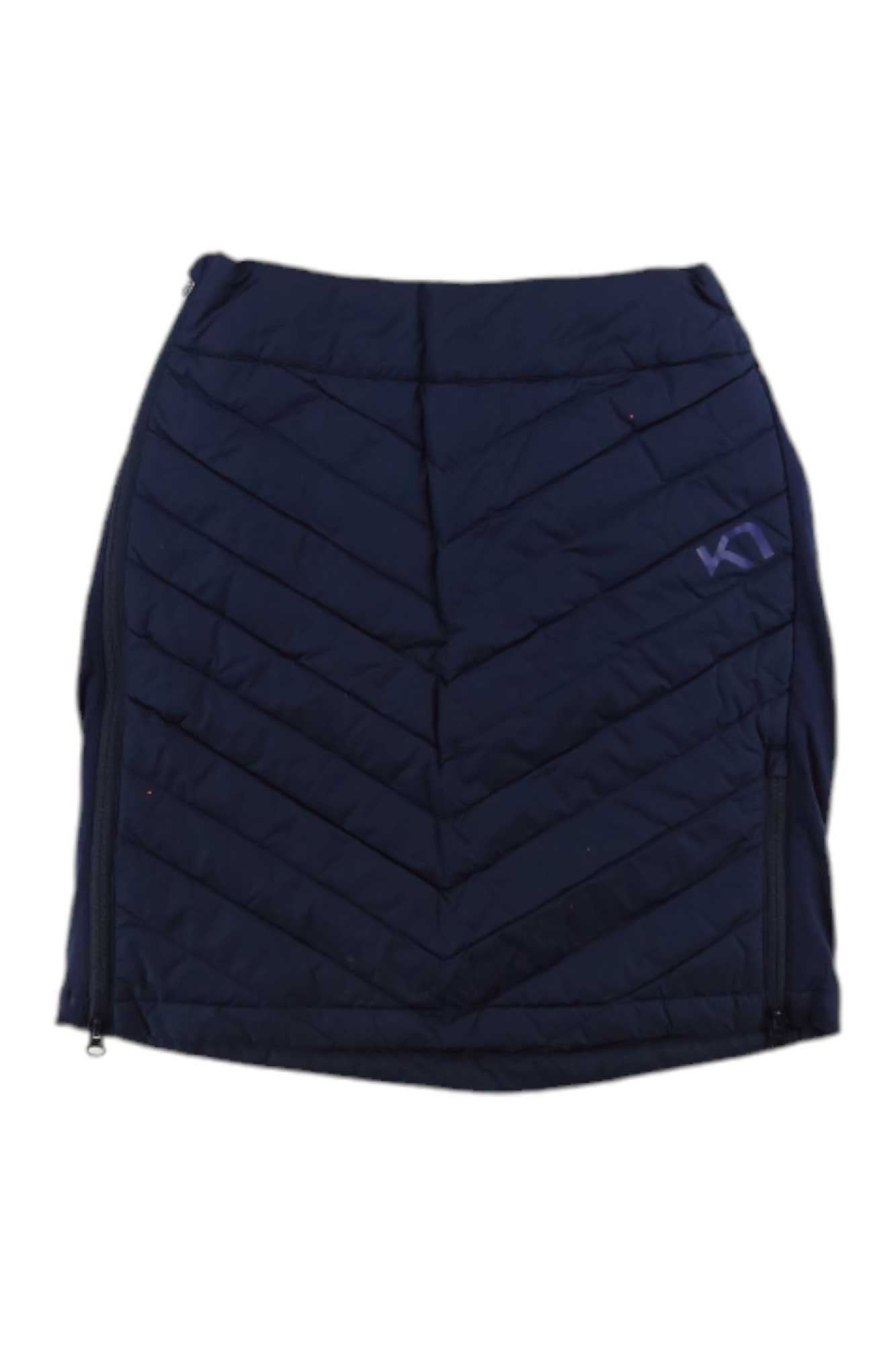 The Kari Traa Women's Eva Skirt is a black, quilted, knee-length down skirt with diagonal stitching and side zippers. A purple K1 logo on the upper right adds style, making it perfect for cold-weather hiking.