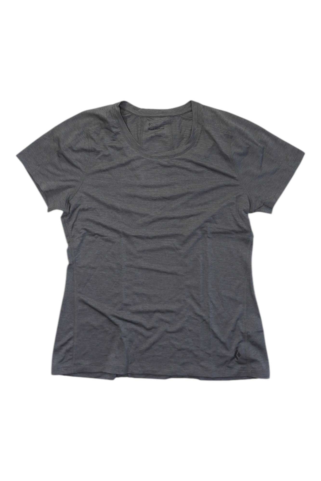 The Black Diamond Womens Lightwire Tech Tee, a plain short-sleeve dark gray moisture-wicking shirt with a crew neck, is laid flat on a white background and appears slightly wrinkled.