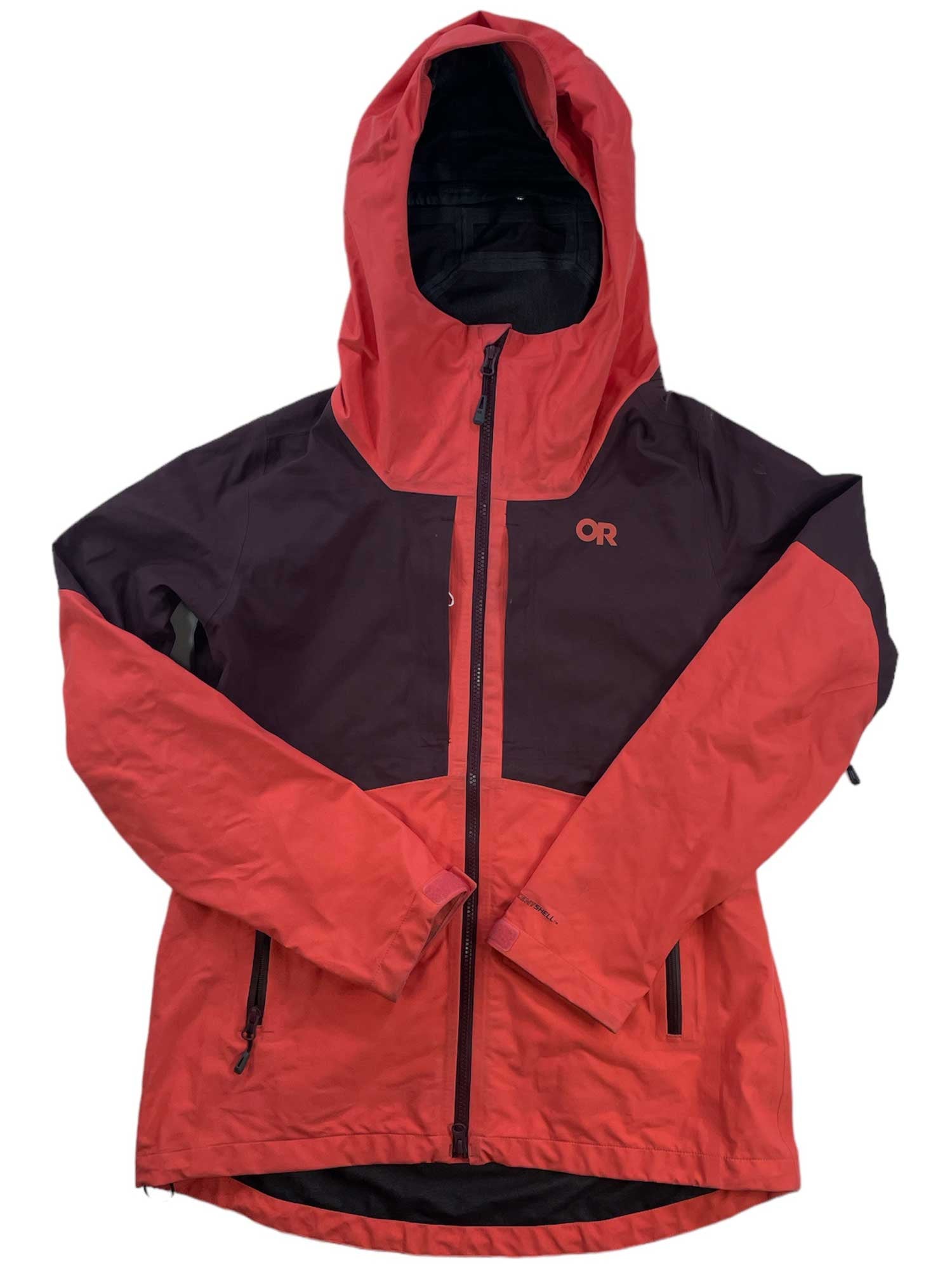 The Outdoor Research Women's Skytour AscentShell Jacket is a waterproof, breathable jacket with a hood, front zipper, two zippered pockets, and the OR logo. It features red sleeves and lower body with maroon chest/shoulders—perfect for snowsports.