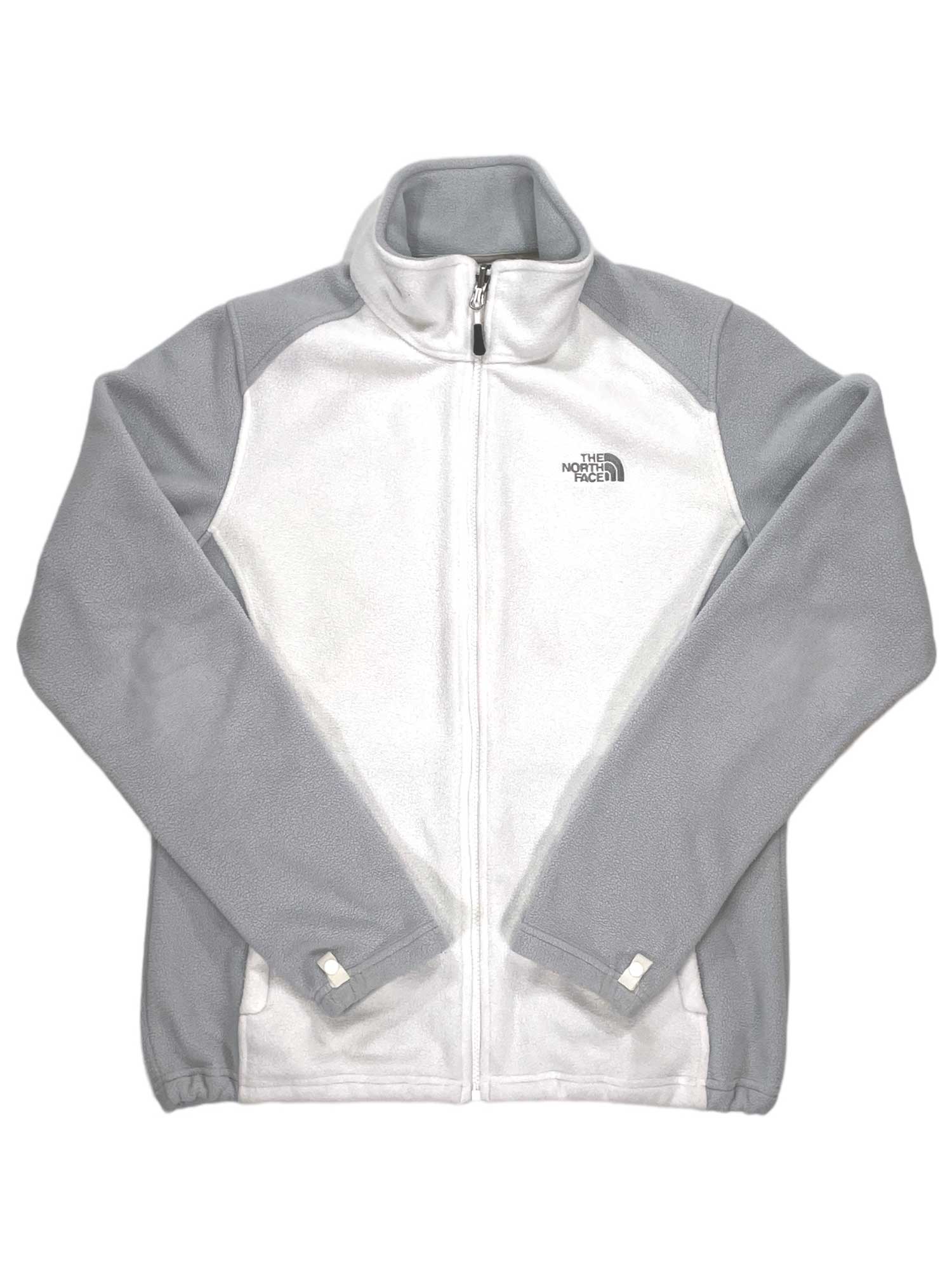 The Khumbu Fleece Jacket is a white and light gray midweight fleece with long sleeves, a high collar, left chest logo, side pockets, color-blocked design, and quick-drying polyester for comfort.