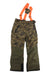 A pair of Helly Hansen Juniors No Limits 2.0 Pants with a camouflage design and orange suspenders, featuring multiple zippered pockets and reinforced knees, is laid flat on a white background.