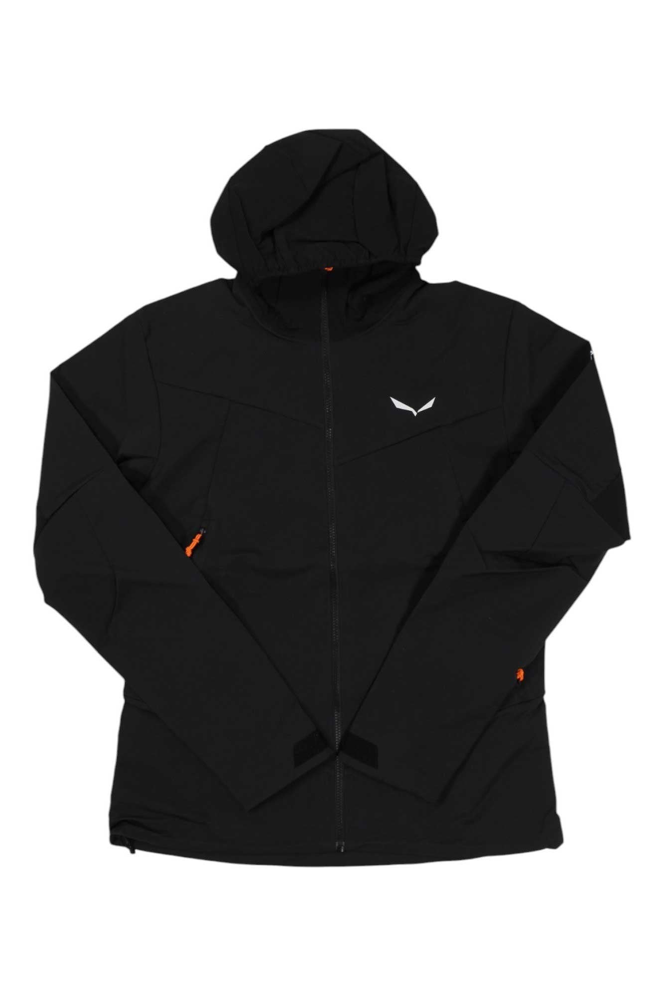 A black Salewa Mens Sella DST Jacket with a hood, front zipper, two side pockets with orange zippers, and a small white chest logo is shown laid flat on a white background. This jacket is designed for outdoor use and is waterproof.