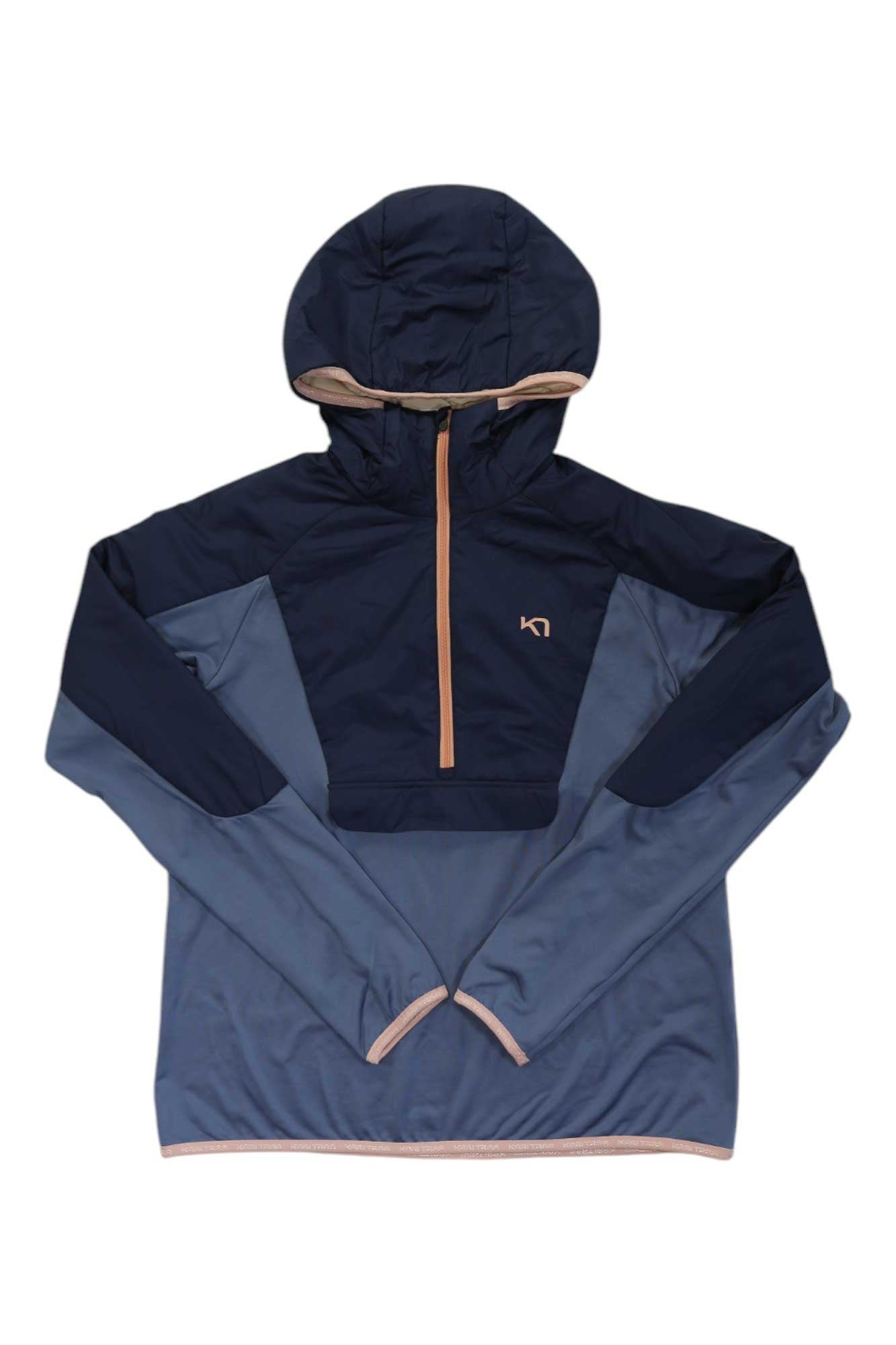 The Kari Traa Womens Signe Hybrid Jacket is a two-tone blue, water-resistant winter jacket with a hood, partial front zipper, tan trim, thumb holes at the cuffs, and a small chest logo for added style and functionality.