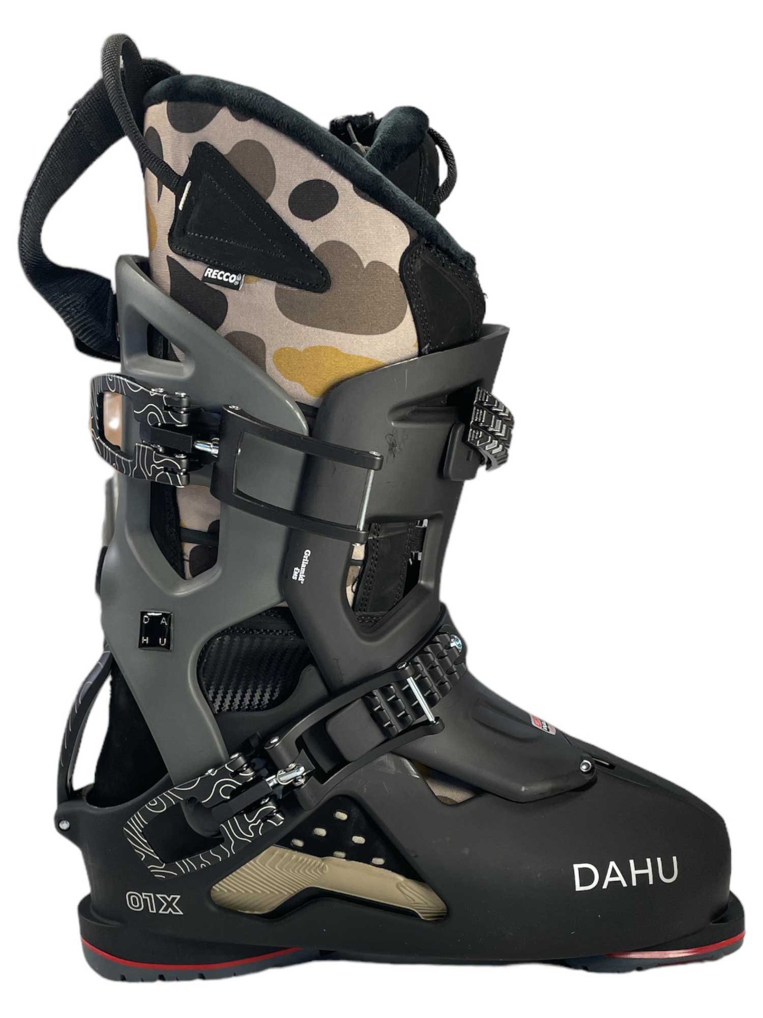 The Dahu Mens Ecorce 01 X Limited Edition M120 Flex Ski Boot features a black and gray design with multiple adjustable buckles, a camo inner lining, and DAHU branding on the side. US shipping available.