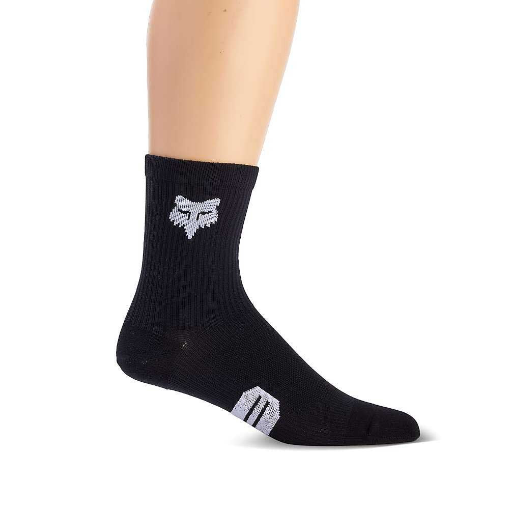 The Fox 6 Inch Ranger Sock is a black crew sock with a white fox head logo on the side, featuring compression arch support and shown on a mannequin foot against a plain white background.