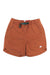 The Topo Designs Mens River 6 Inch Short features a rust color, elastic waistband with green drawstring, white logo on the left leg, quick-dry fabric, relaxed fit, and slight side slits at the hem.