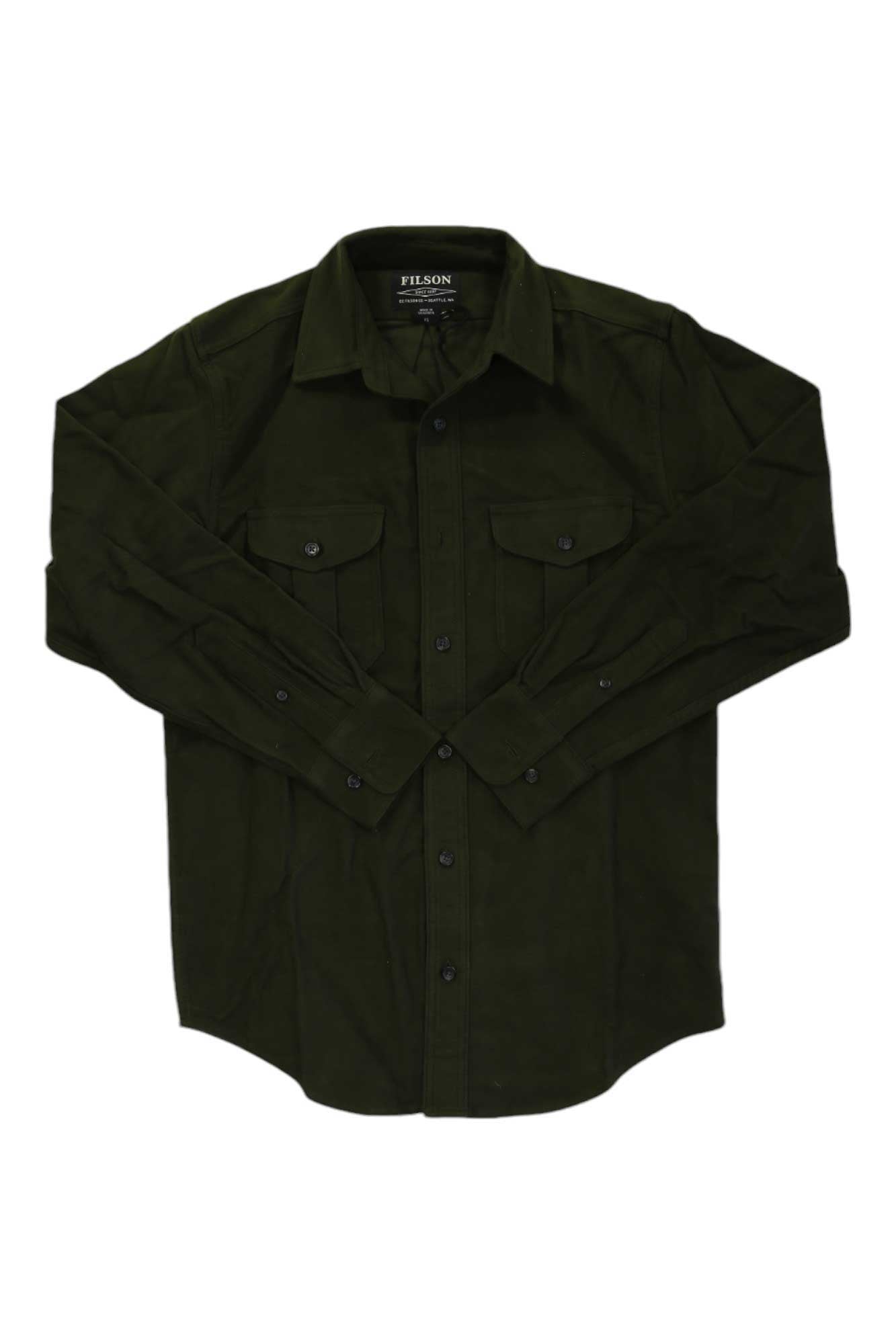 The Filson Men's Moleskin Seattle Shirt is a dark green, long-sleeve casual shirt with a collar, two chest pockets, and wind-resistant fabric, shown laid flat on a white background.