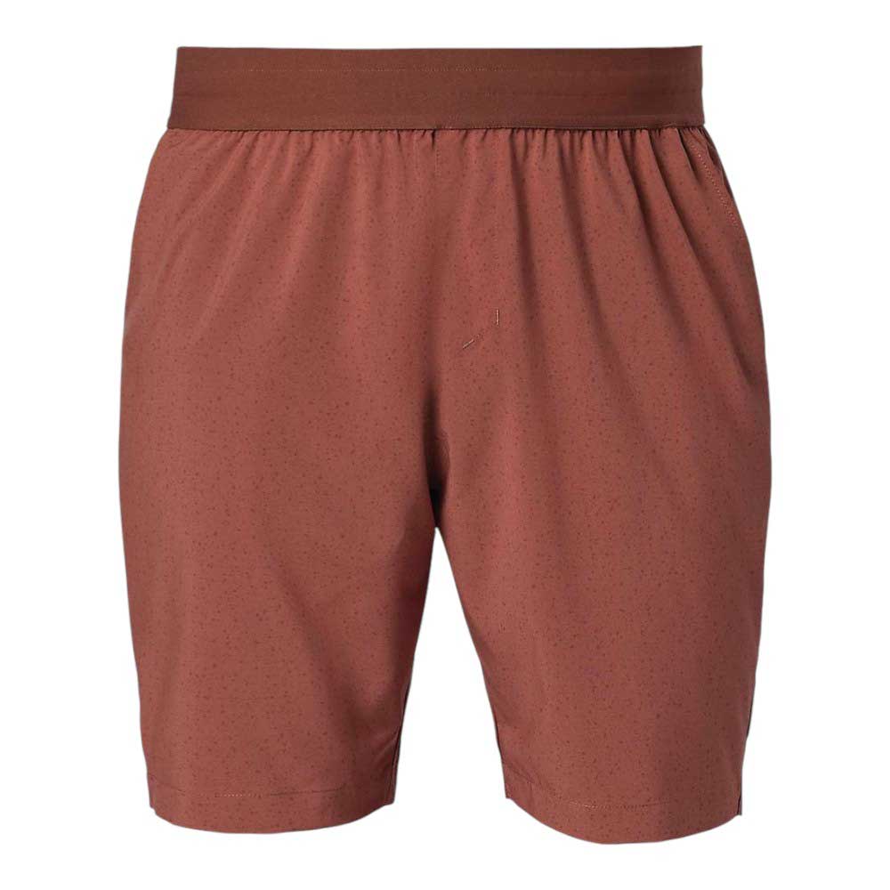 The Flylow Men's Safari 8.5 Inch Short features a reddish-brown color, subtle dotted pattern, elastic waistband, no visible logos or pockets—perfect for mountain biking or sun-protective outdoor activities. Displayed on a white background.
