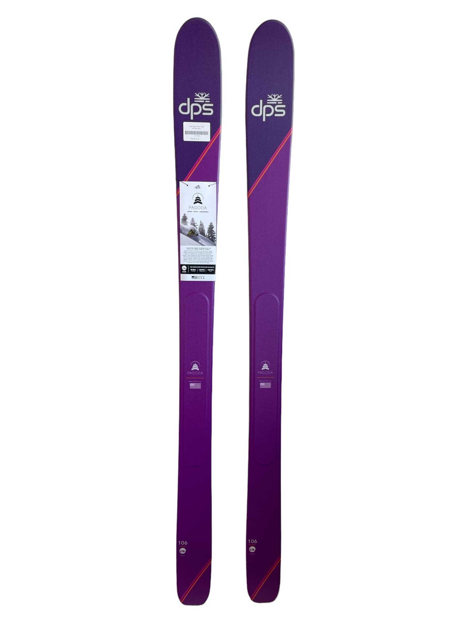 Purple ski pair with white label graphics and red diagonal stripe