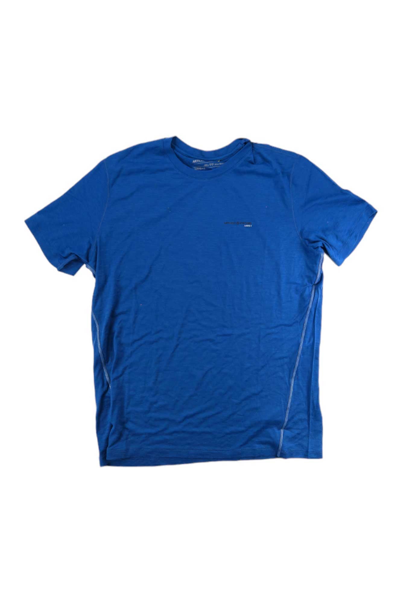 The Artilect Mens Sprint Tee is a soft Nuyarn fabric short-sleeve running shirt in plain blue, with subtle stitching and a small printed logo on the left chest, shown laid flat on a white background.